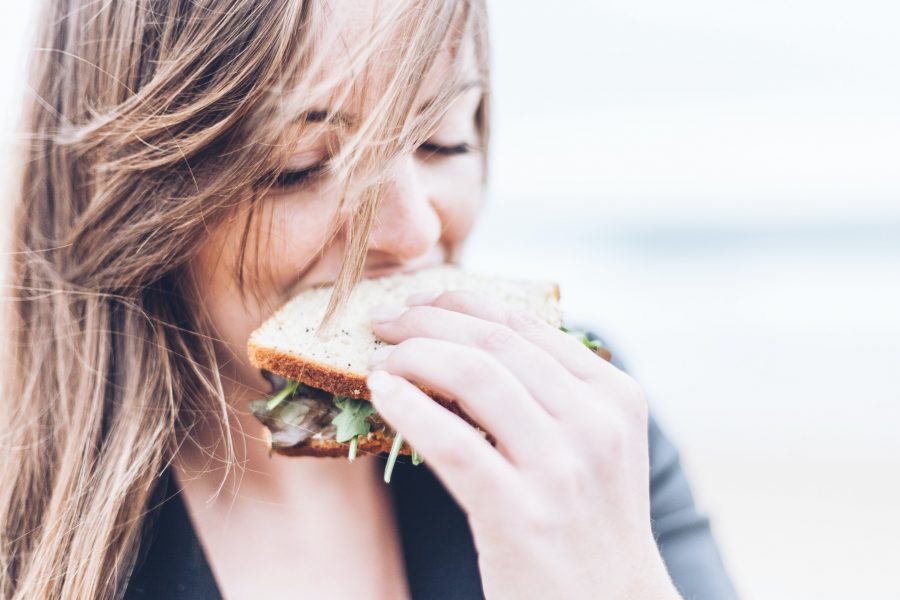 nutrition to live | girl eating sandwich